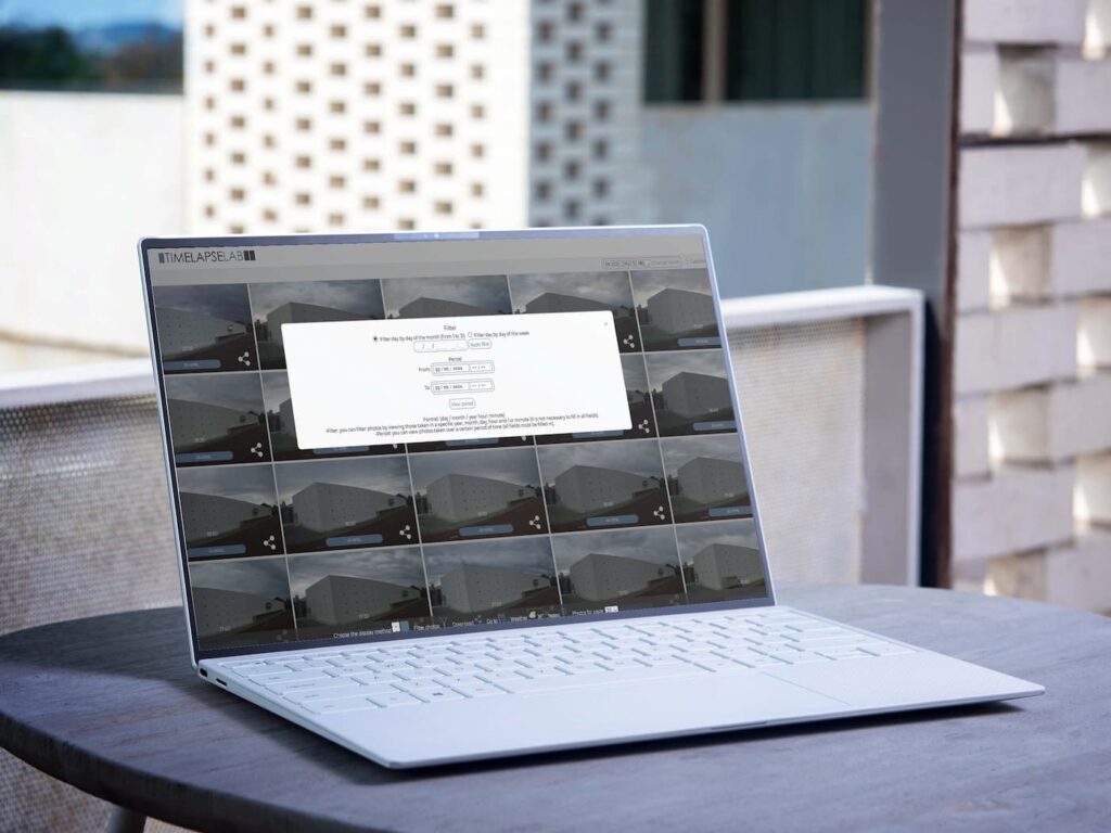 Laptop displaying the Timelapselab dashboard for construction monitoring